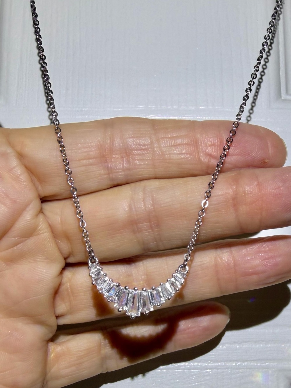 Park Lane Silvertone Crystal Baguette Crescent Necklace. 19” Length